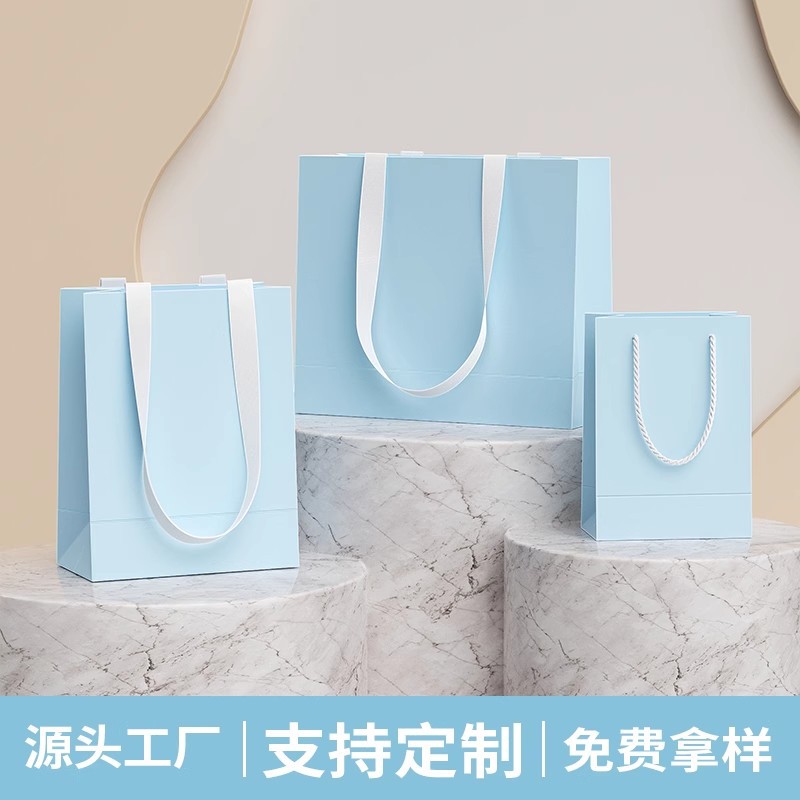 High-grade shopping bag cream wind light blue packaging bag gift bag custom logo clothing store portable white cardboard bag 5