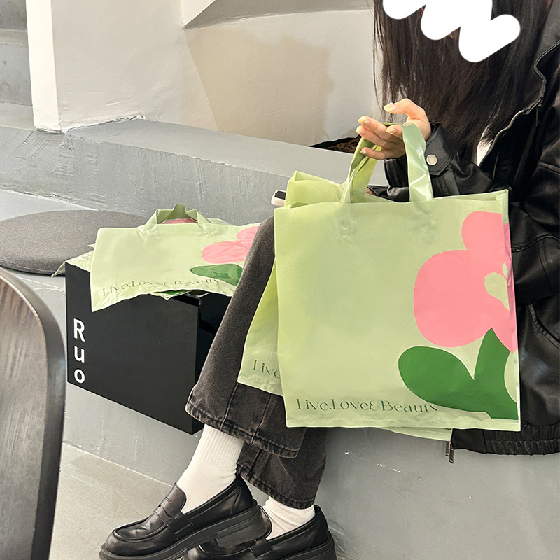 Cute clothing bag portable plastic bag customized logo clothing store handbag women's clothing store shopping bag wholesale