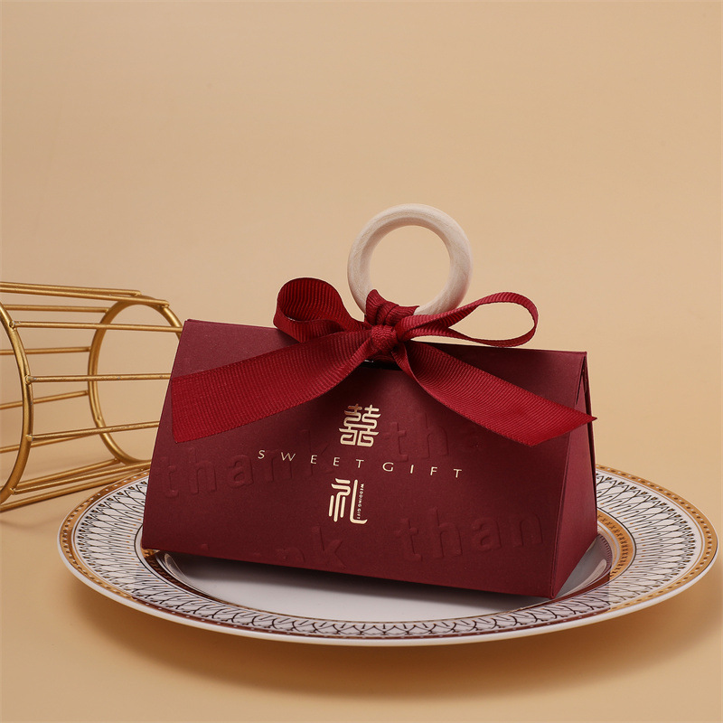 Picture of Light luxury champagne hand-held triangle wedding candy box wooden ring hand gift box wedding candy box wholesale