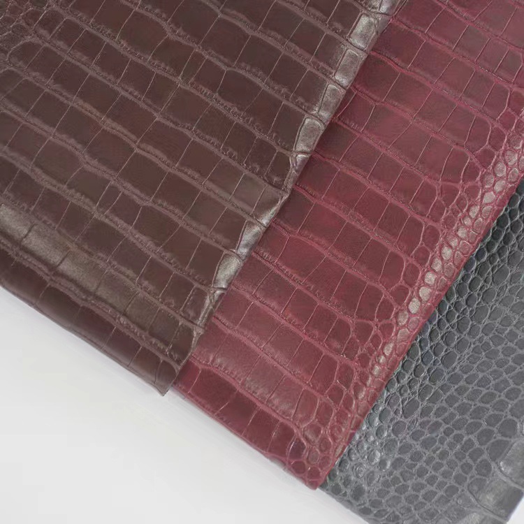 Picture of Factory wholesale spunlace fabric bottom crocodile pattern PVC leather luggage wine box packaging notebook cover artificial leather
