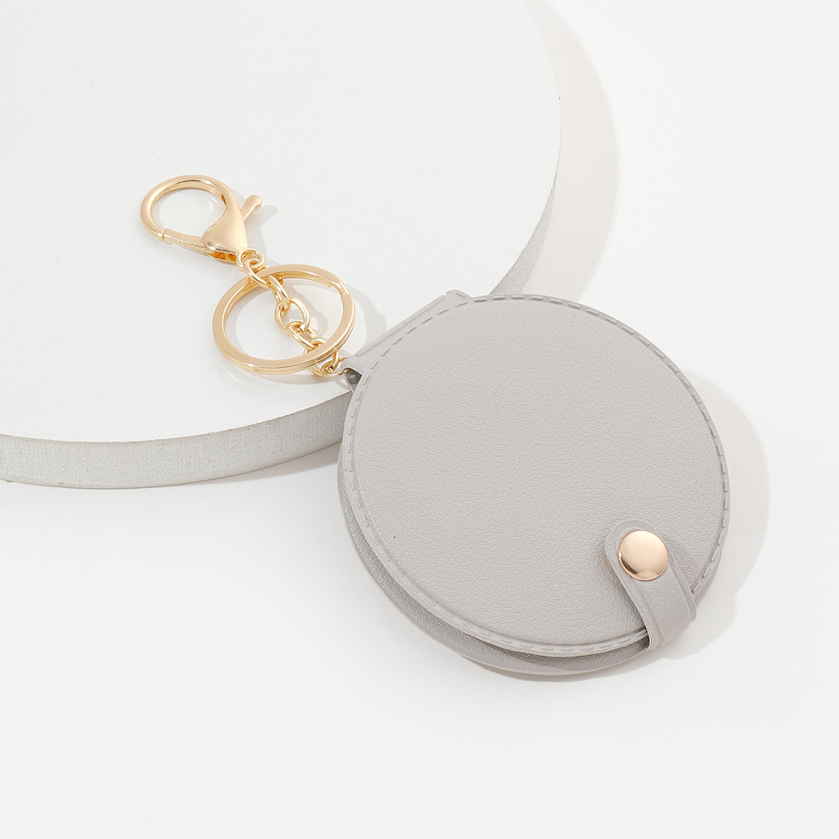 Picture of Creative round makeup mirror keychain pu leather car bag pendant carry-on solid color mini small mirror