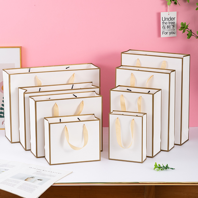 in stock Wholesale Thickened Gift Phnom Penh Paper Bag Clothing Packaging Bag Women's Shopping Bag Kraft Paper White Card Handbag