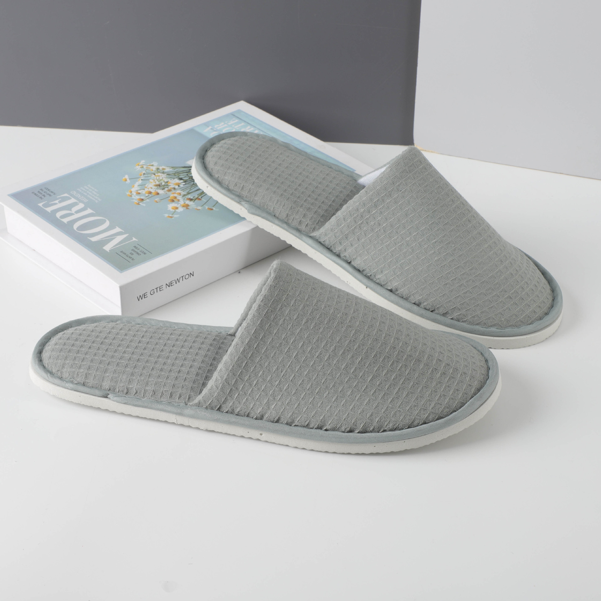 Picture of Hotel and homestay disposable waffle slippers home hospitality travel thickened slippers can be wholesale ordered LOGO