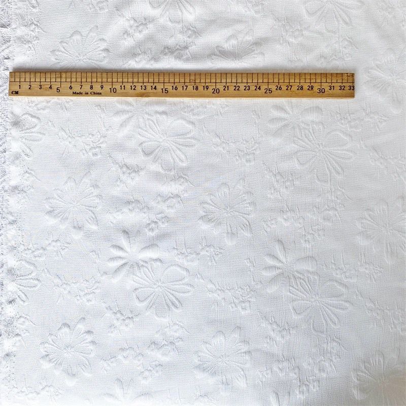 Picture of Floating sunflower four-sided elastic fabric milk white Chinese clothing three-dimensional fabric pleated texture flower jacquard cheongsam manufacturers