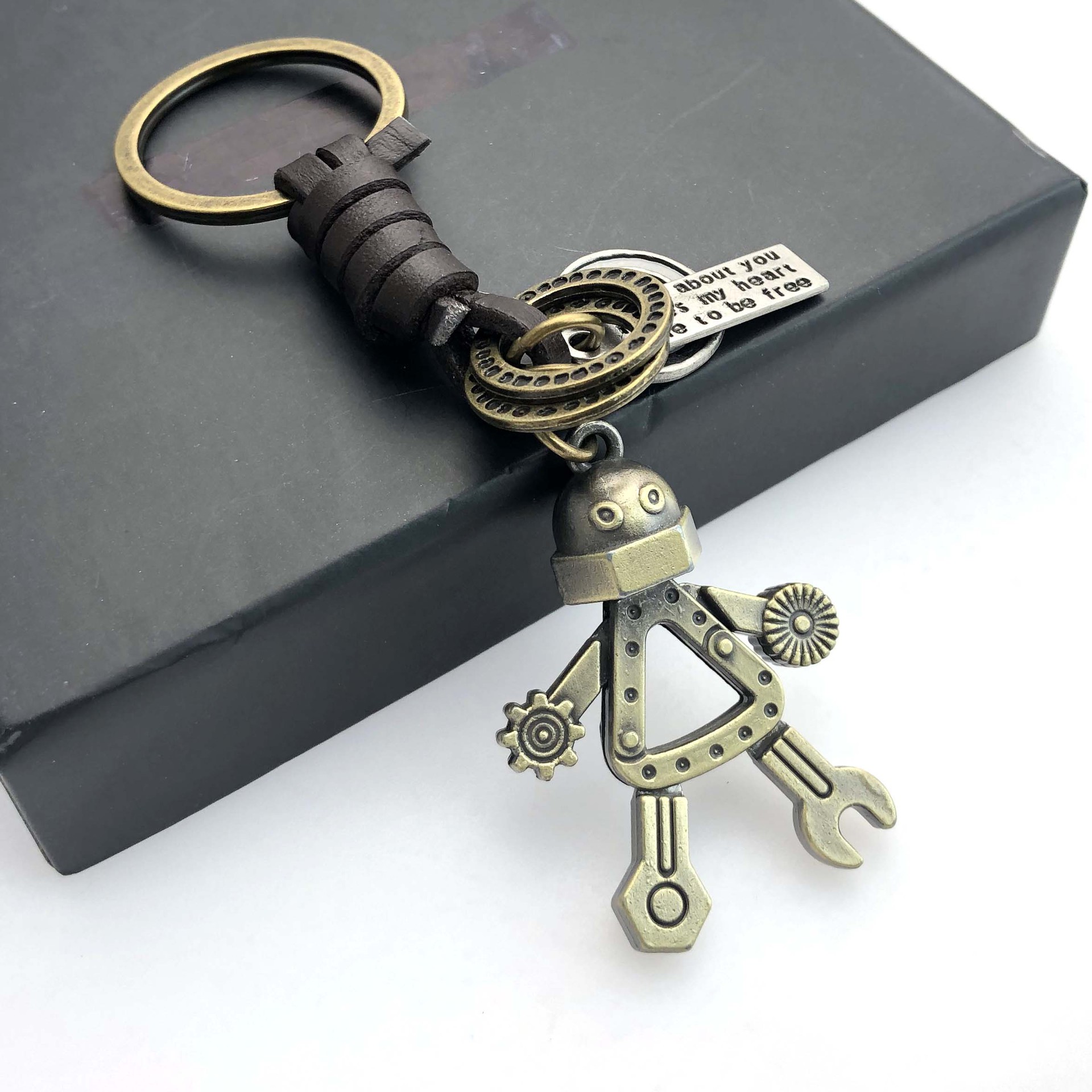 Cross-border Europe and the United States hand-woven leather key chain triangle human personality hands and feet movable robot bag pendant ornaments