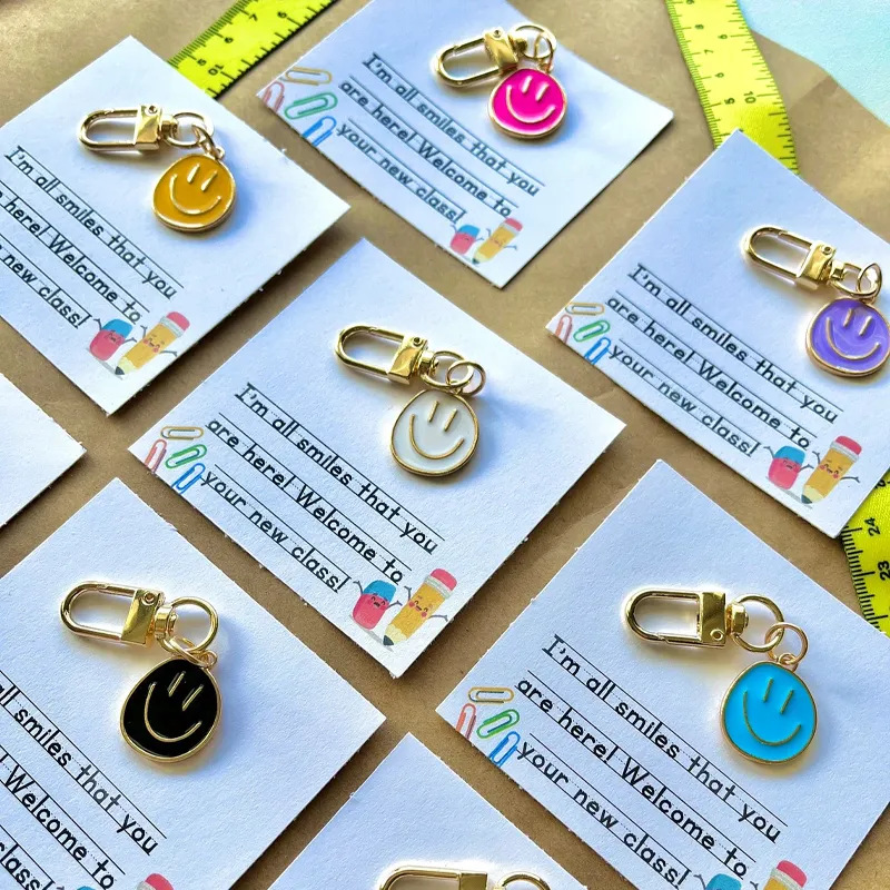 Picture of Cross-border e-commerce alloy color dripping smiley face keychain electroplated gold irregular expression bag pendant accessories
