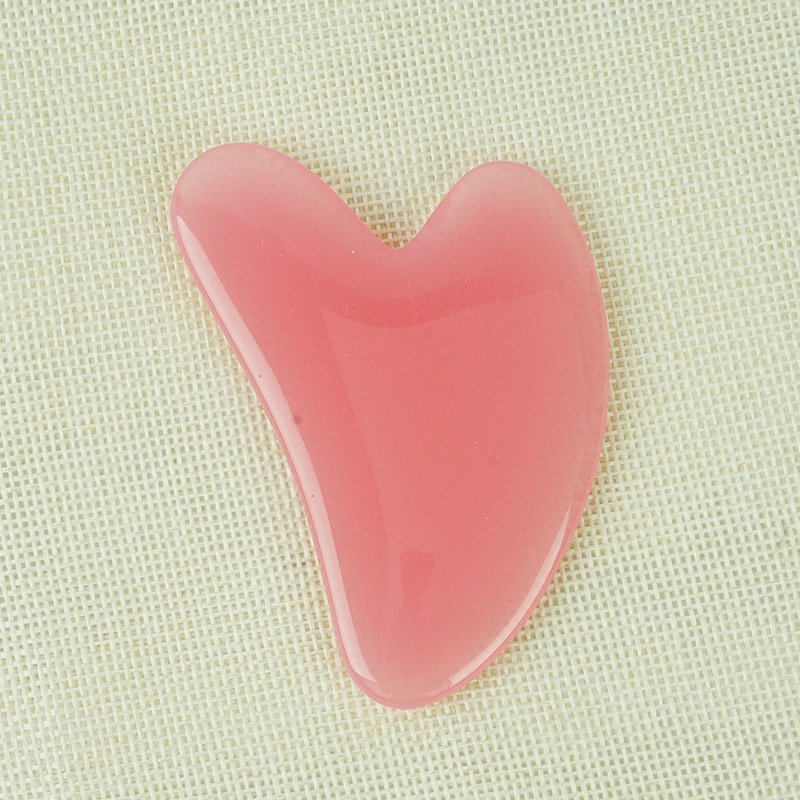 Picture of Manufacturer's Wholesale Resin Heart-Shaped Gua Sha Tools for Massaging the Back, Neck, Waist, and Full Body Meridians, Made of Natural Materials
