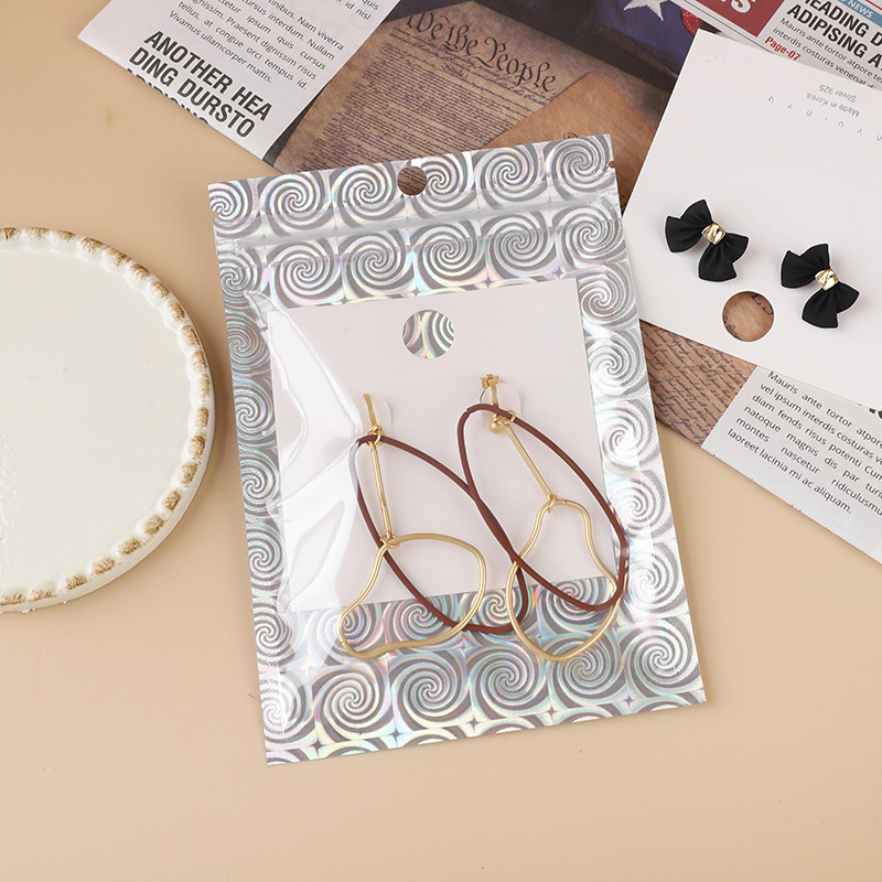 Spiral pattern laser Yin and Yang bone bag gift jewelry self-sealing bag toy small items translucent packaging bag spot