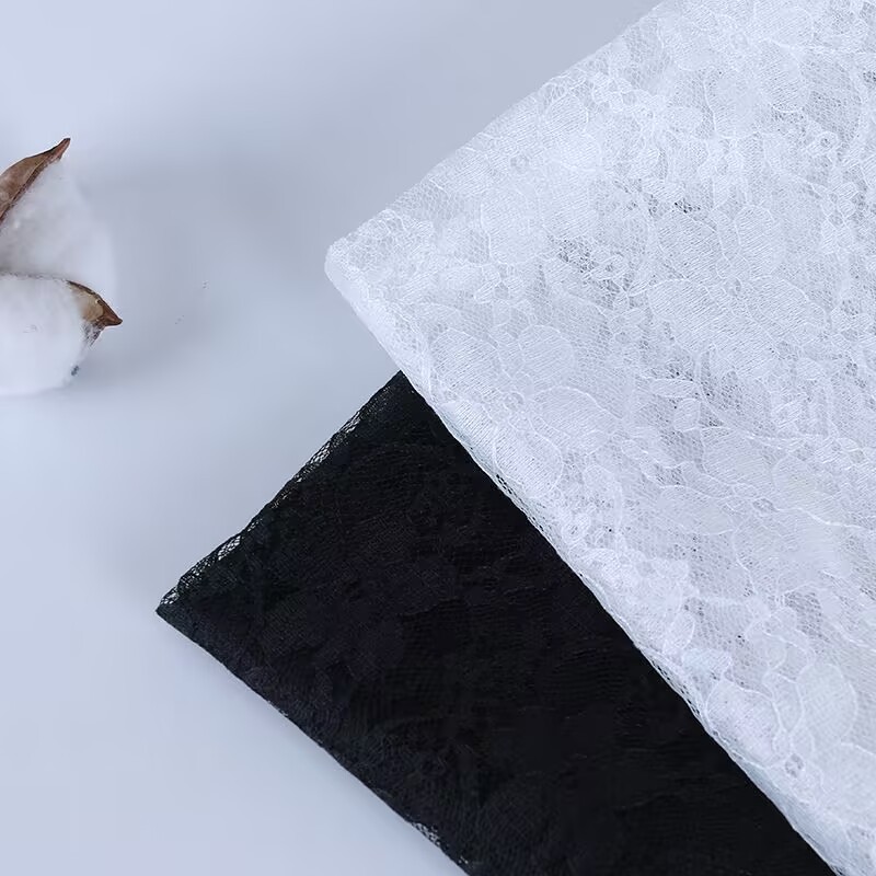 Small plum blossom lace fabric, lace edge, black and white hollow embroidery, mesh wedding dress base layer, cover-up fabric, in stock