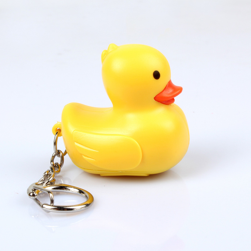 In stock cute cartoon duck car keychain LED luminous sound creative electronic toy small gift bag ornaments