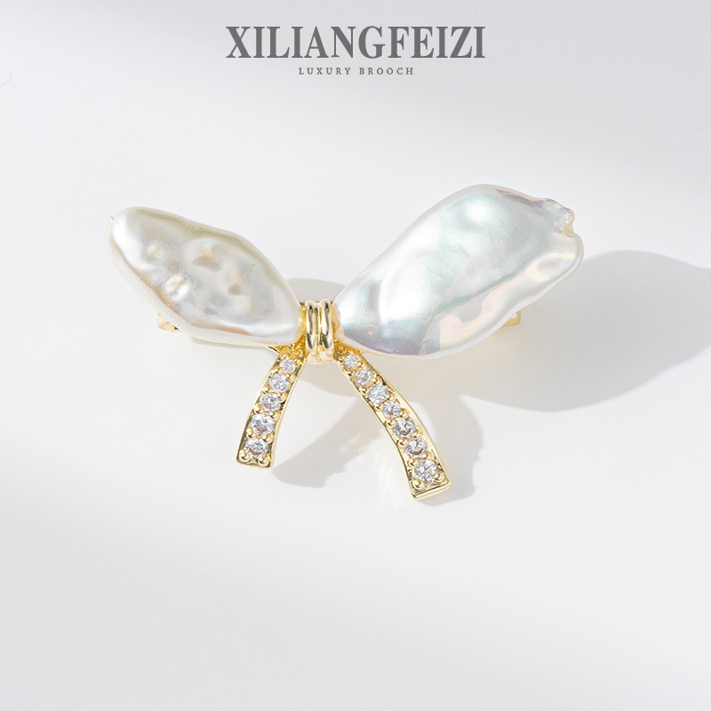 Xiliang concubine copper zircon exquisite special-shaped beading bow brooch cardigan design anti-exposure pin gift