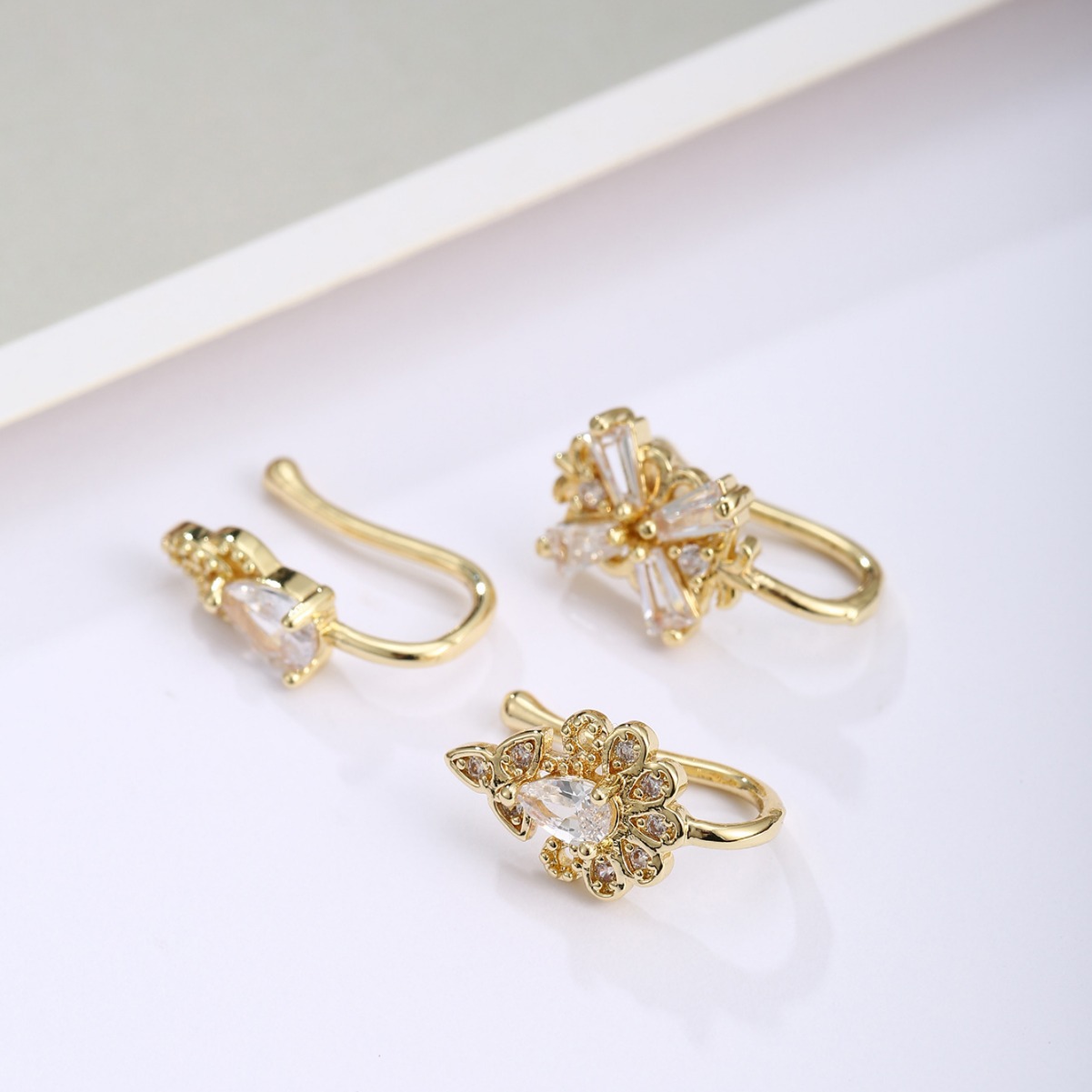 Picture of Exquisite and fashionable three-piece four-leaf clover copper plated real gold micro-inlaid zircon nose clip suit best-selling European and American nose combination