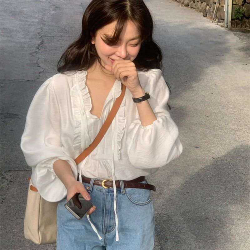 Korean 2023 Spring Gentle Sweet V-neck Strap Stitching Ear Edge Design Bubble Sleeve Loose Solid Color Shirt
