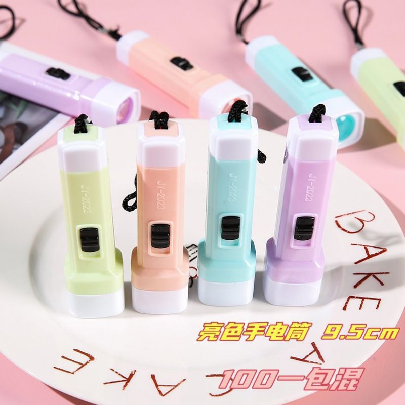 Macaron color small flashlight, children's strong light flashlight, wholesale street stall, practical small household appliance gift wholesale
