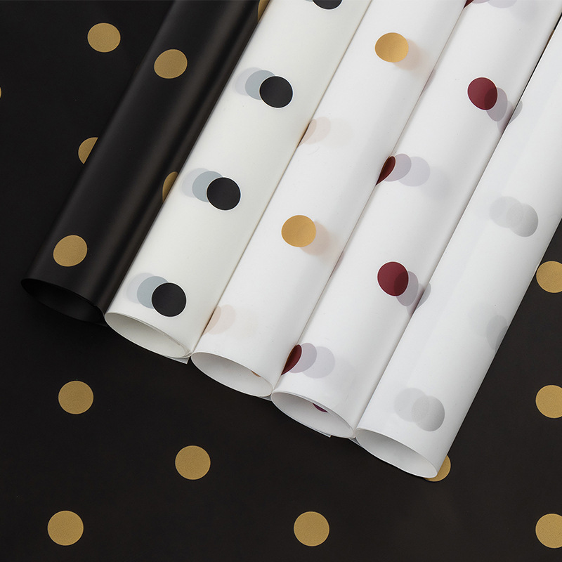 Amazon new flower paper caramel film wave point waterproof floral material bouquet wrapping paper flower packaging wholesale