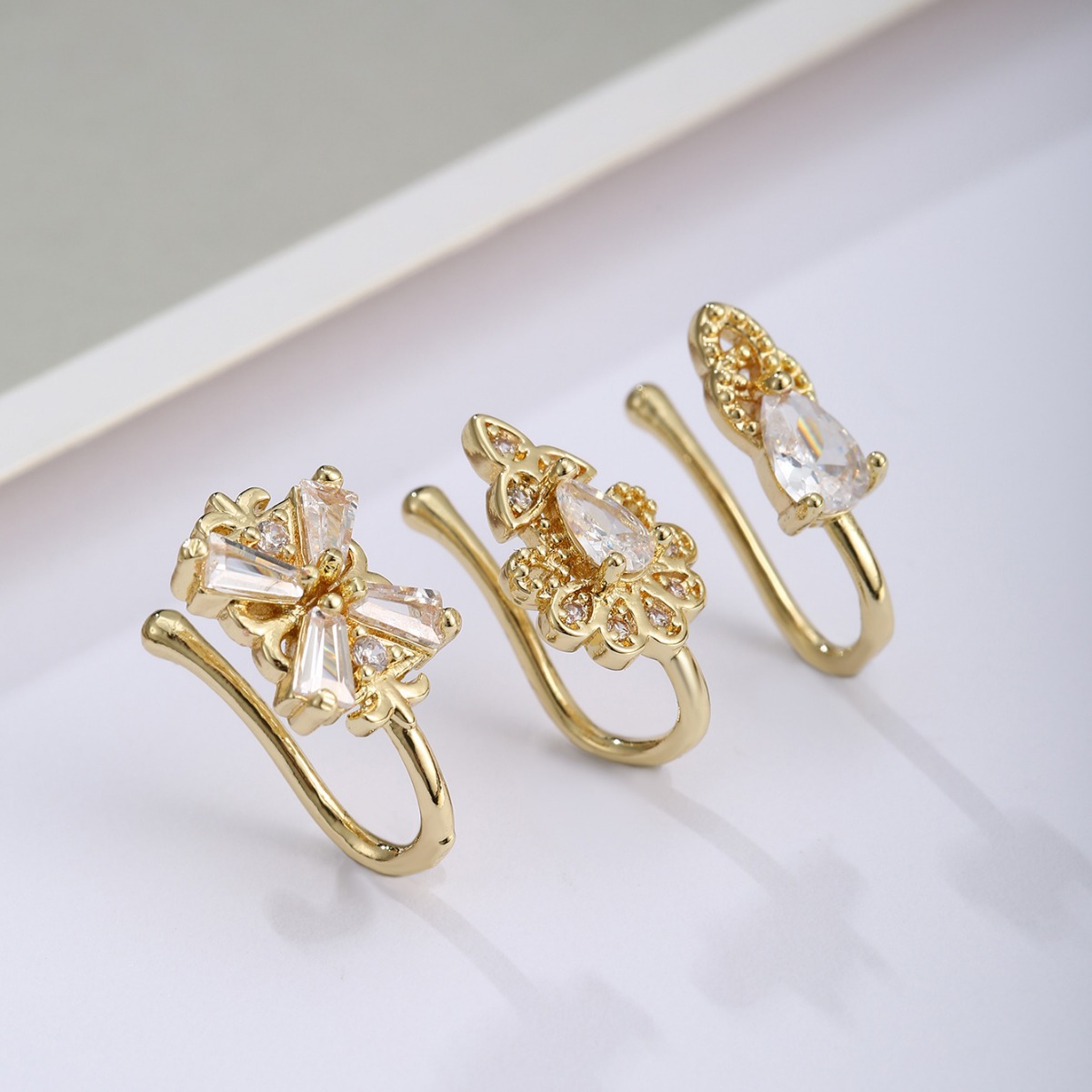 Exquisite and fashionable three-piece four-leaf clover copper plated real gold micro-inlaid zircon nose clip suit best-selling European and American nose combination