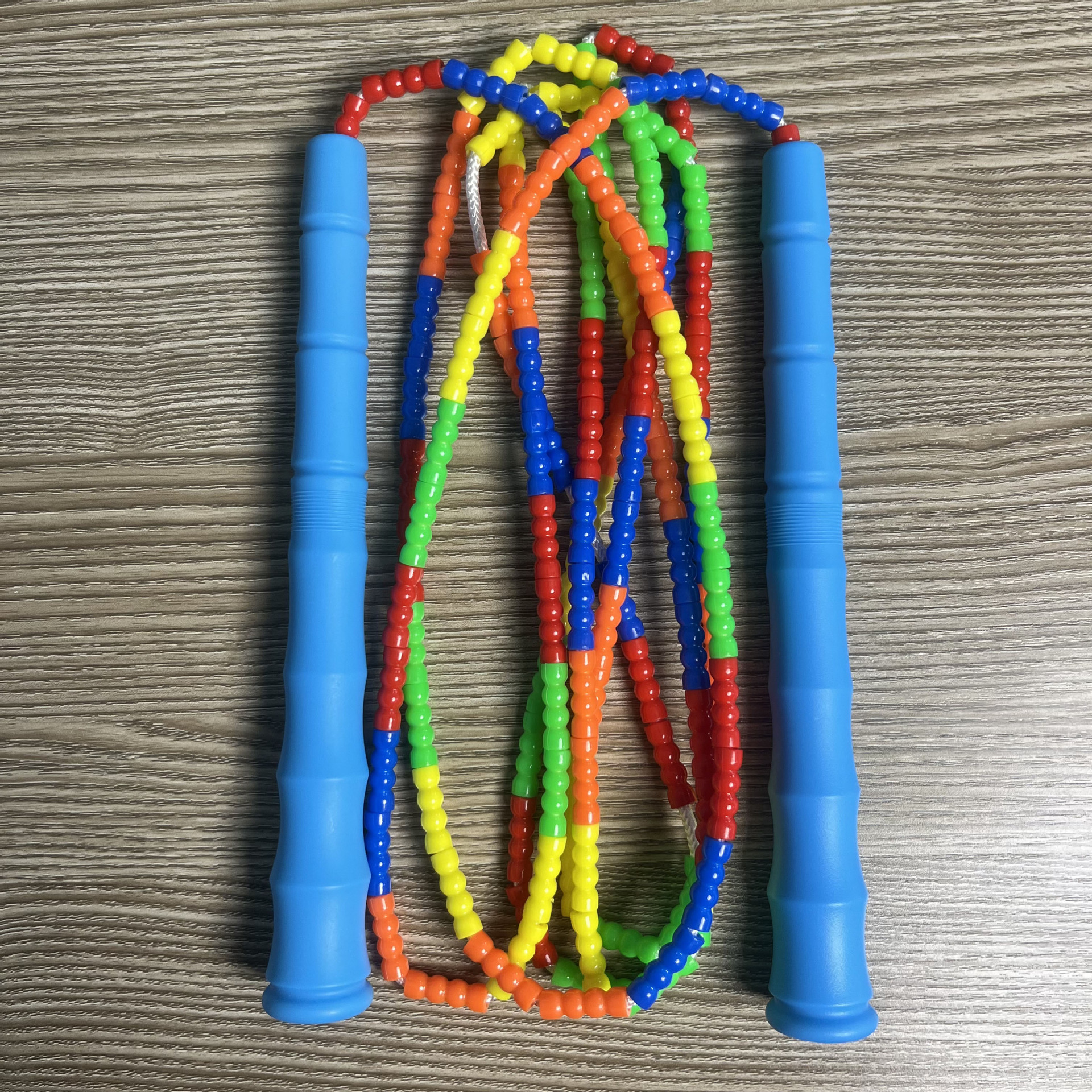 Picture of Manufacturer Wholesale Children's Fitness Sports Pattern Skipping Rope Kindergarten Competition Soft Bead Bamboo Skipping Rope for Primary School Students