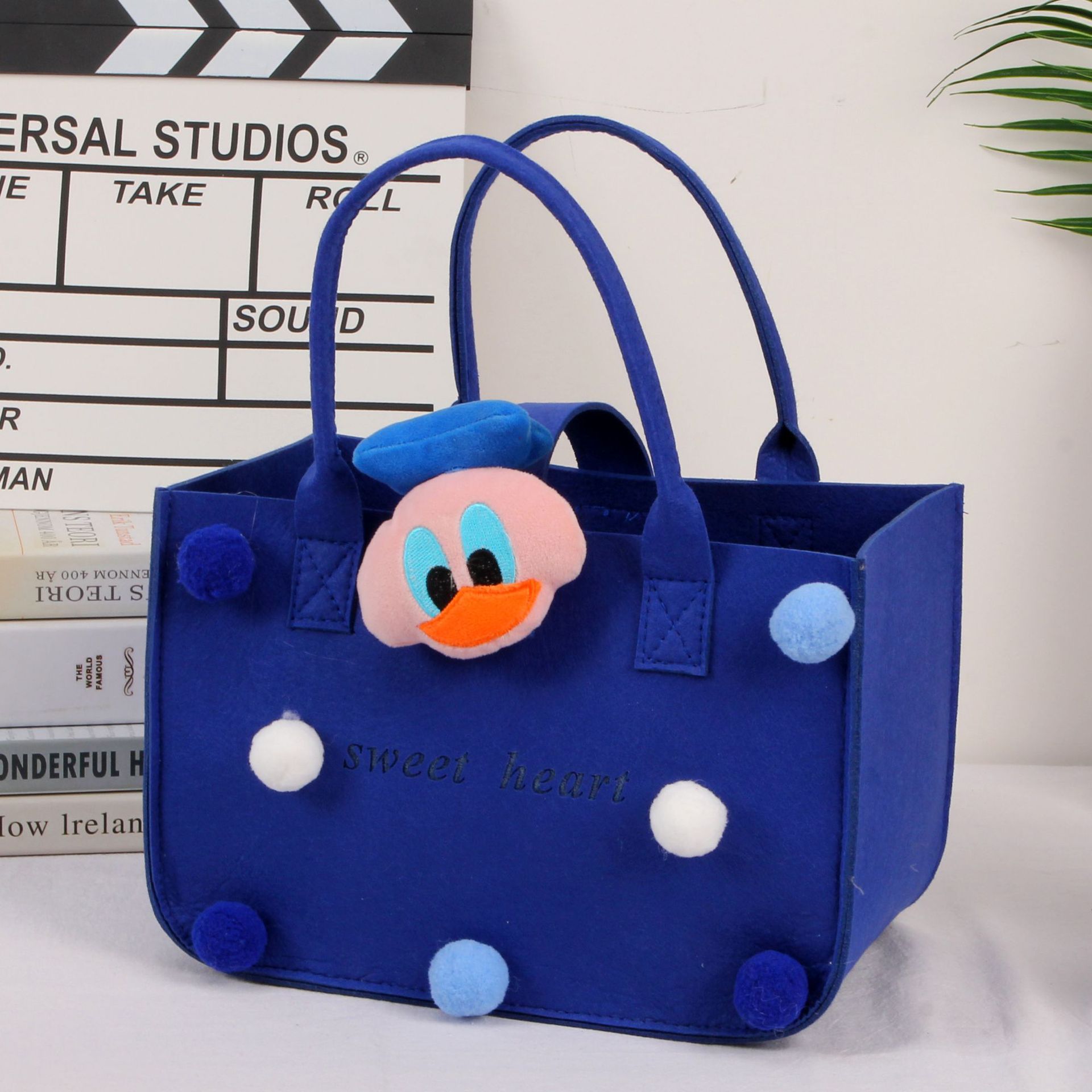 Picture of 2022 felt cartoon handbag hand bag gift bag Net Red full moon wine birthday gift bag wholesale