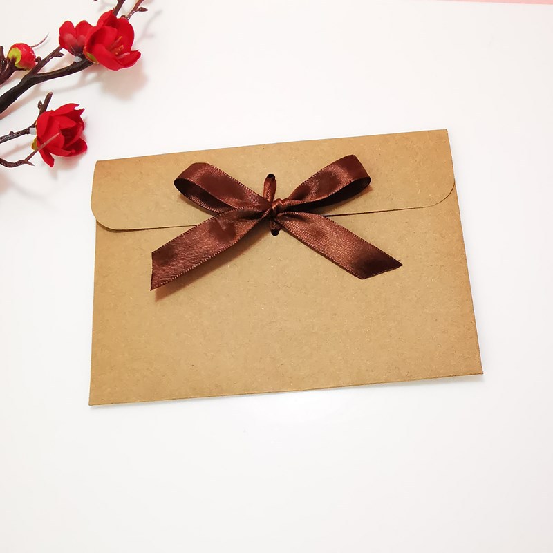 Picture of European envelope Kraft paper style vintage greeting card blessing card packaging bag creative bow CD bag wholesale