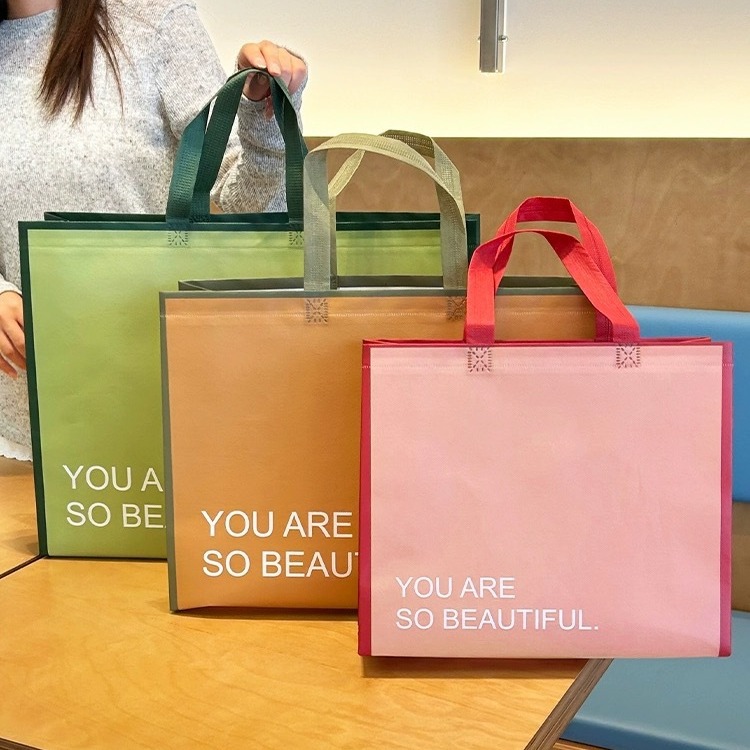In stock internet celebrity style printable logo non-woven fabric laminating bag clothing bag gift bag waterproof large capacity