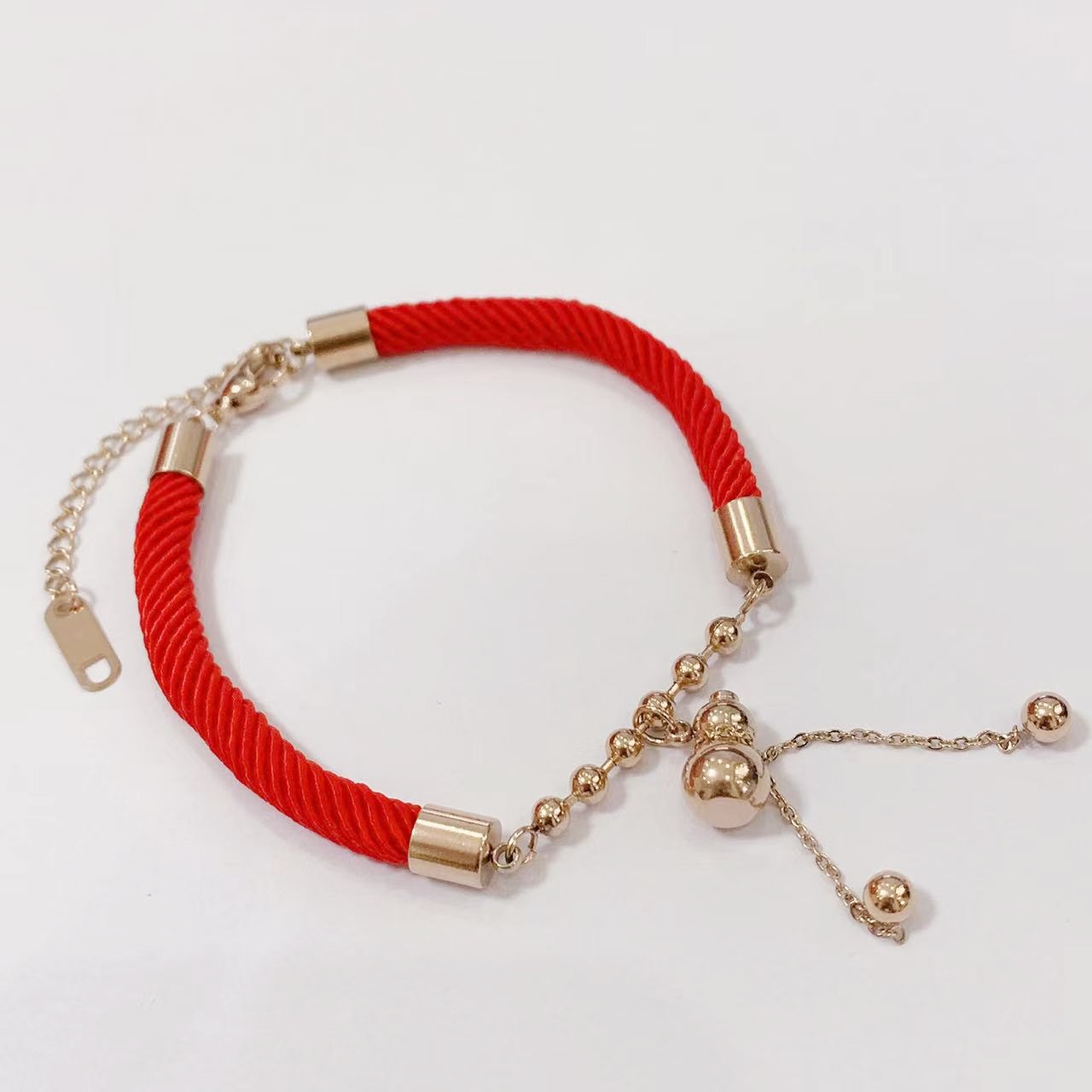 This year festive red gourd copper red rope bracelet money bag rose gold female titanium steel color retention Tanabata gift