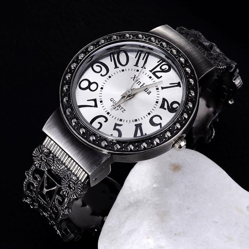 2023 new XINHUA hollow flower round dial women's bracelet watch foreign trade hot open bracelet watch