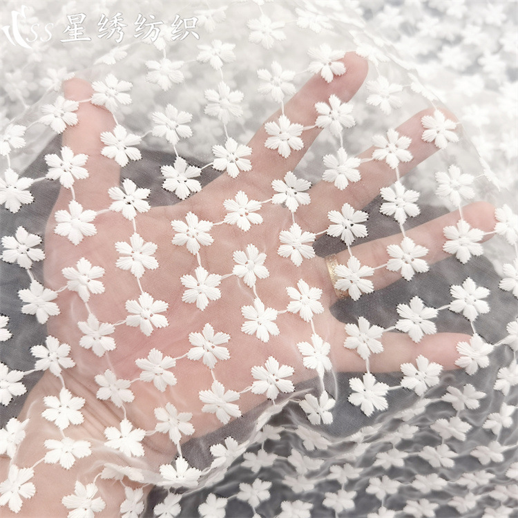 Spring and summer mesh embroidery three-dimensional small snowflake high-density organza embroidery skin-friendly women's clothing children's clothing bag fabric