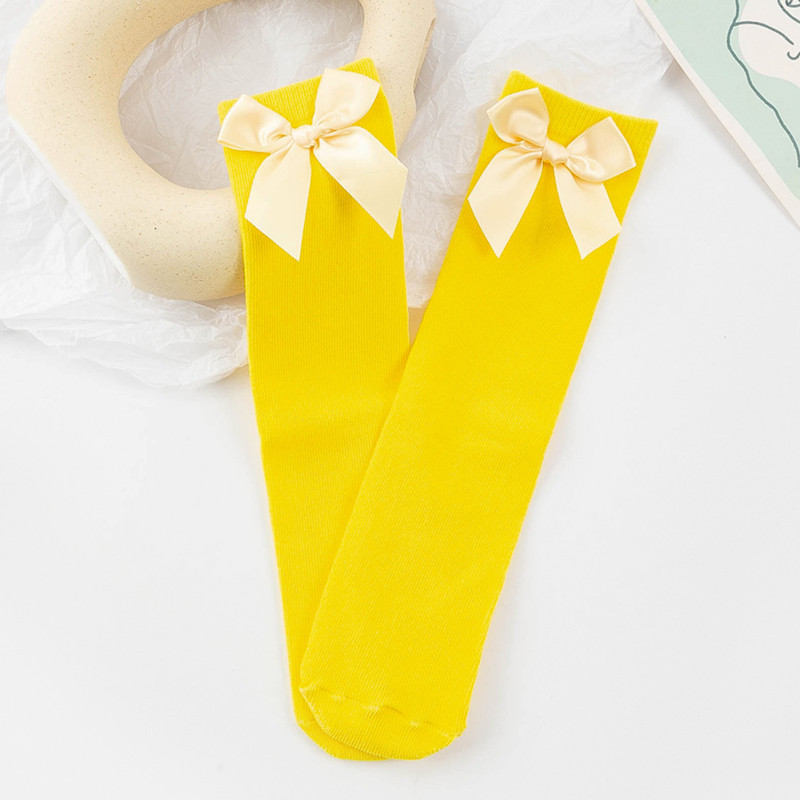 Picture of Children's Mid-Calf Socks, Solid Color Bowknot, Suitable for Both Small and Large Children, Slouch Socks That Can Be Worn Front or Back, Straight Tube, No Heel Socks for Girls
