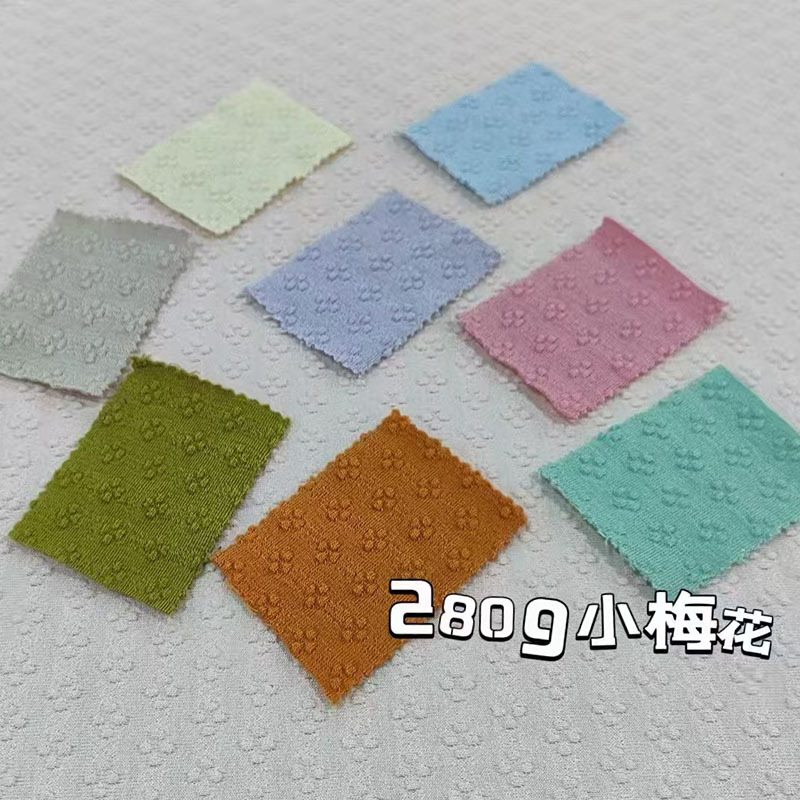 2025 New Knitted Jacquard Fabric Features Bamboo Rib Macaron Lafite Strip Bubble Texture Fabric in stock