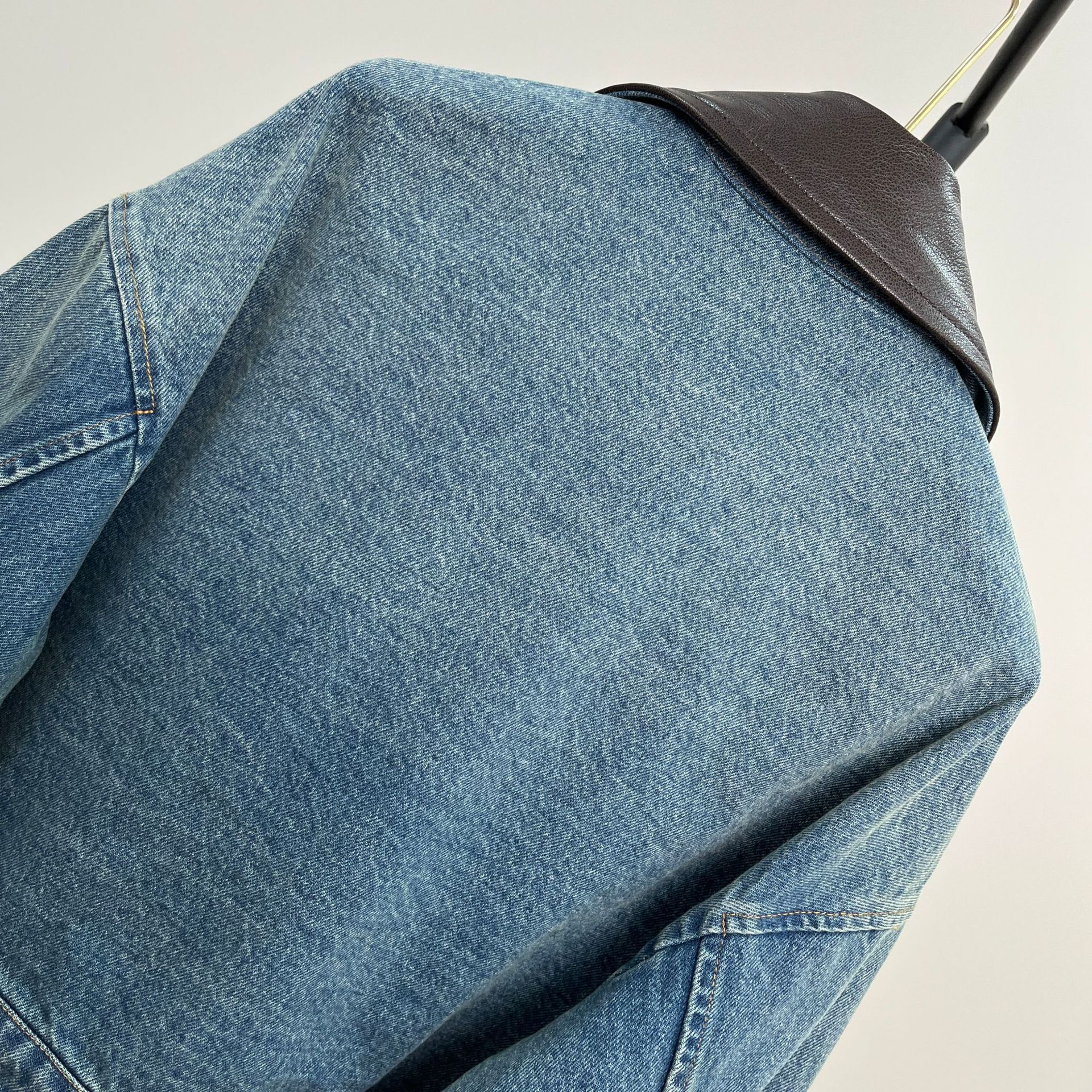 Picture of High-End Heavy-Duty Zipper Denim Jacket for Women with Chest Pocket Triangle Logo Genuine Leather Lapel Short Jacket Top
