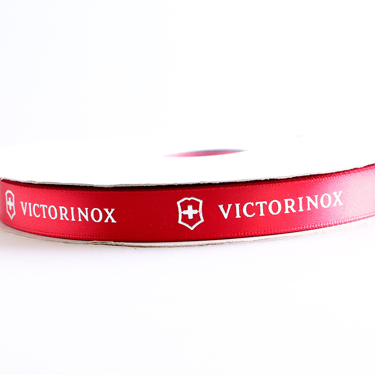 Picture of Make 2.5cm Board Hot-Fix Silver Ribbon Printing Logo English Letters Embossed Hot-Fix Silver Polyester Ribbon Printing