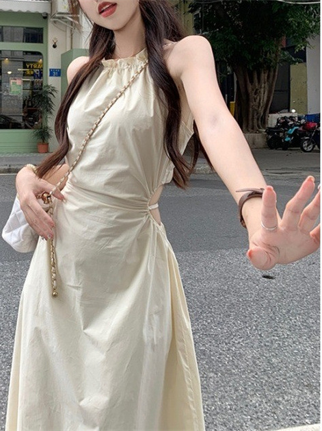 Pure desire halter sling dress women's summer design temperament hollow waist waist slimming tassel long skirt