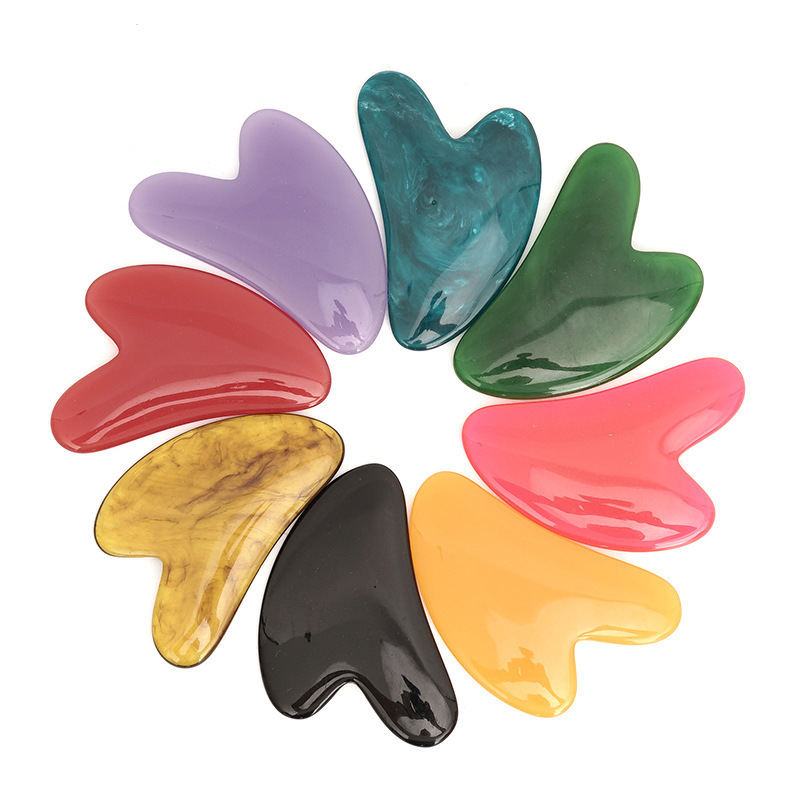 Picture of Manufacturer's Wholesale Resin Heart-Shaped Gua Sha Tools for Massaging the Back, Neck, Waist, and Full Body Meridians, Made of Natural Materials