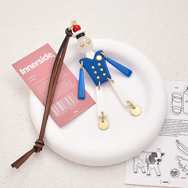 INS super popular European and American cute M Family cartoon robot bag pendant, French light luxury niche design, high-end hanging style