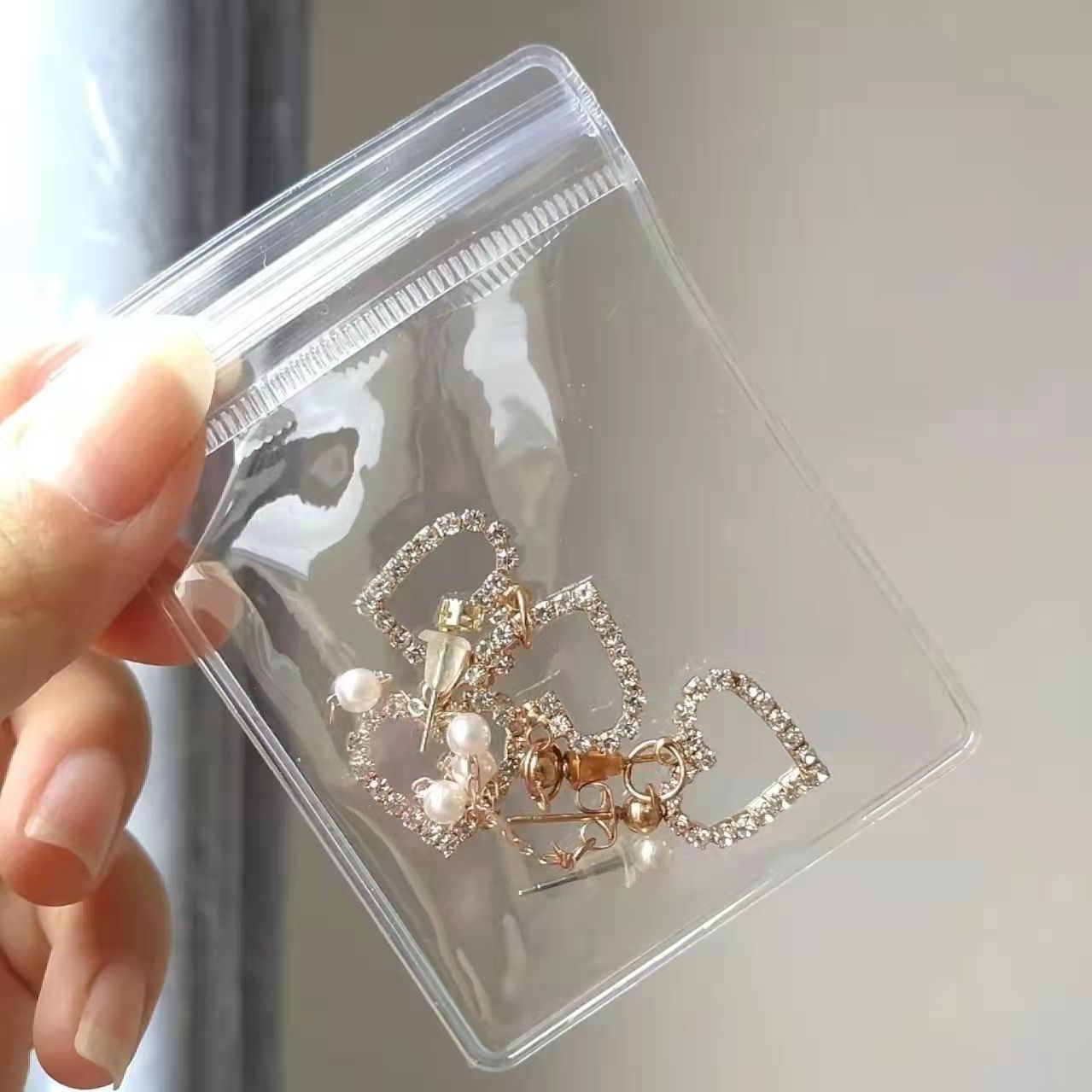 PVC transparent jewelry sealed bag earrings jewelry storage bag jewelry text play hand string self-sealing bag packaging bag manufacturers