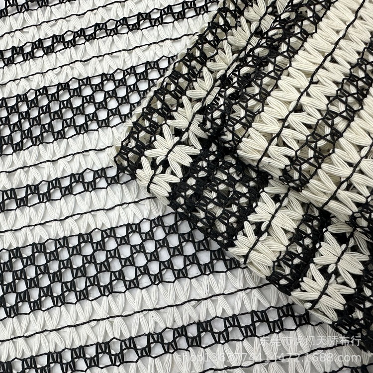 Spot supply knitted black and white mesh jacquard black apricot rice mesh jacquard fabric fashion women's clothing fabric