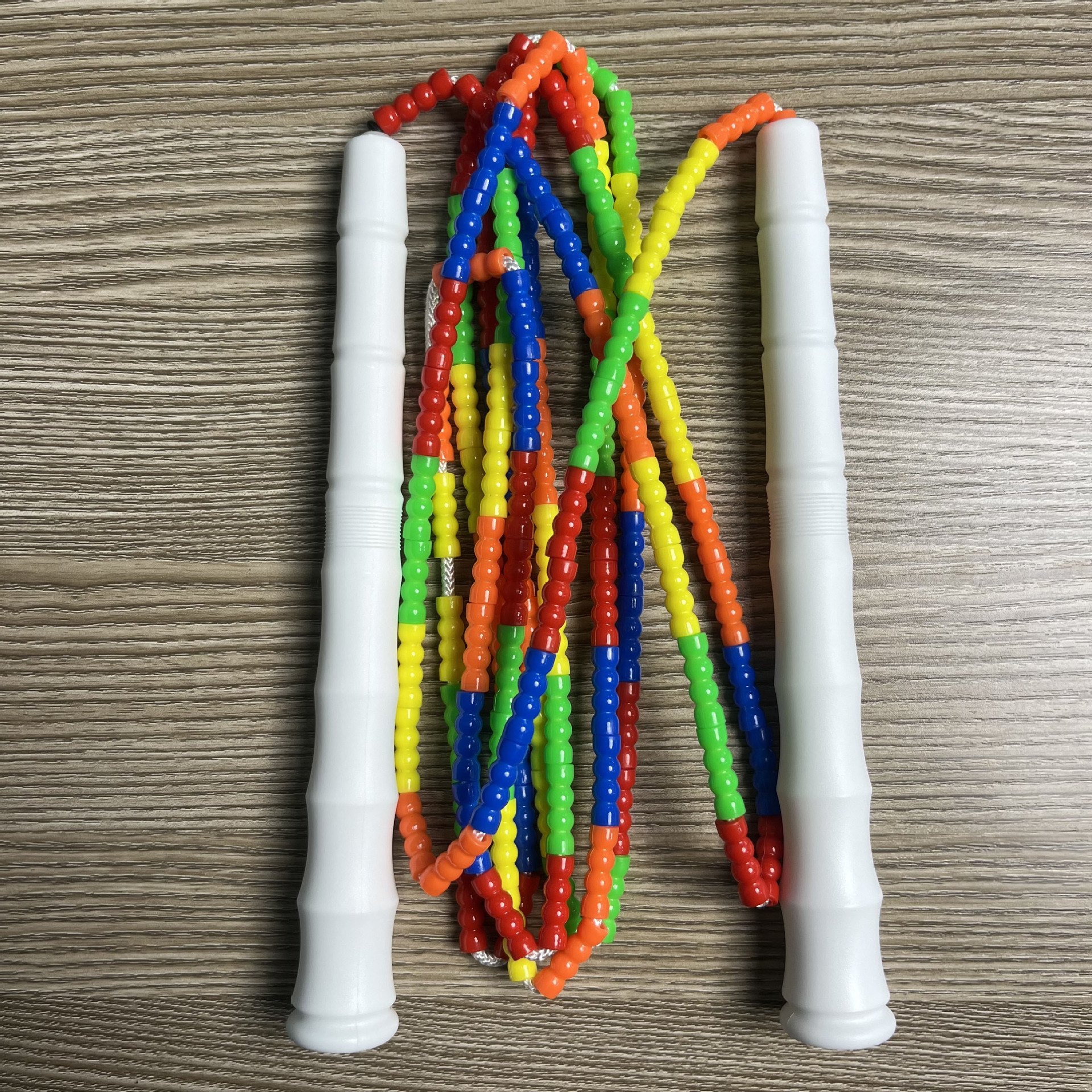 Picture of Manufacturer Wholesale Children's Fitness Sports Pattern Skipping Rope Kindergarten Competition Soft Bead Bamboo Skipping Rope for Primary School Students
