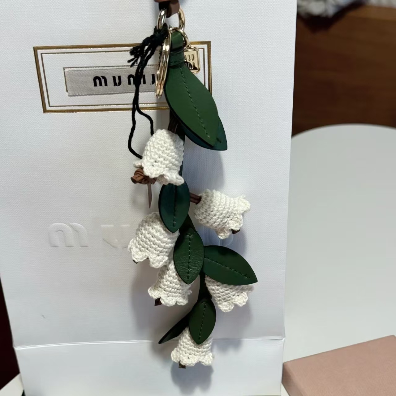 2025 spring new miu miu family with leather blue bell flower women's bag pendant fashion Joker flower wholesale