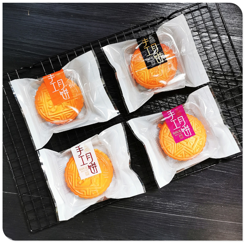 Hand. Worker moon cake 125g moon cake packaging bag flat pocket 100g moon cake baking machine packaging frosted bag
