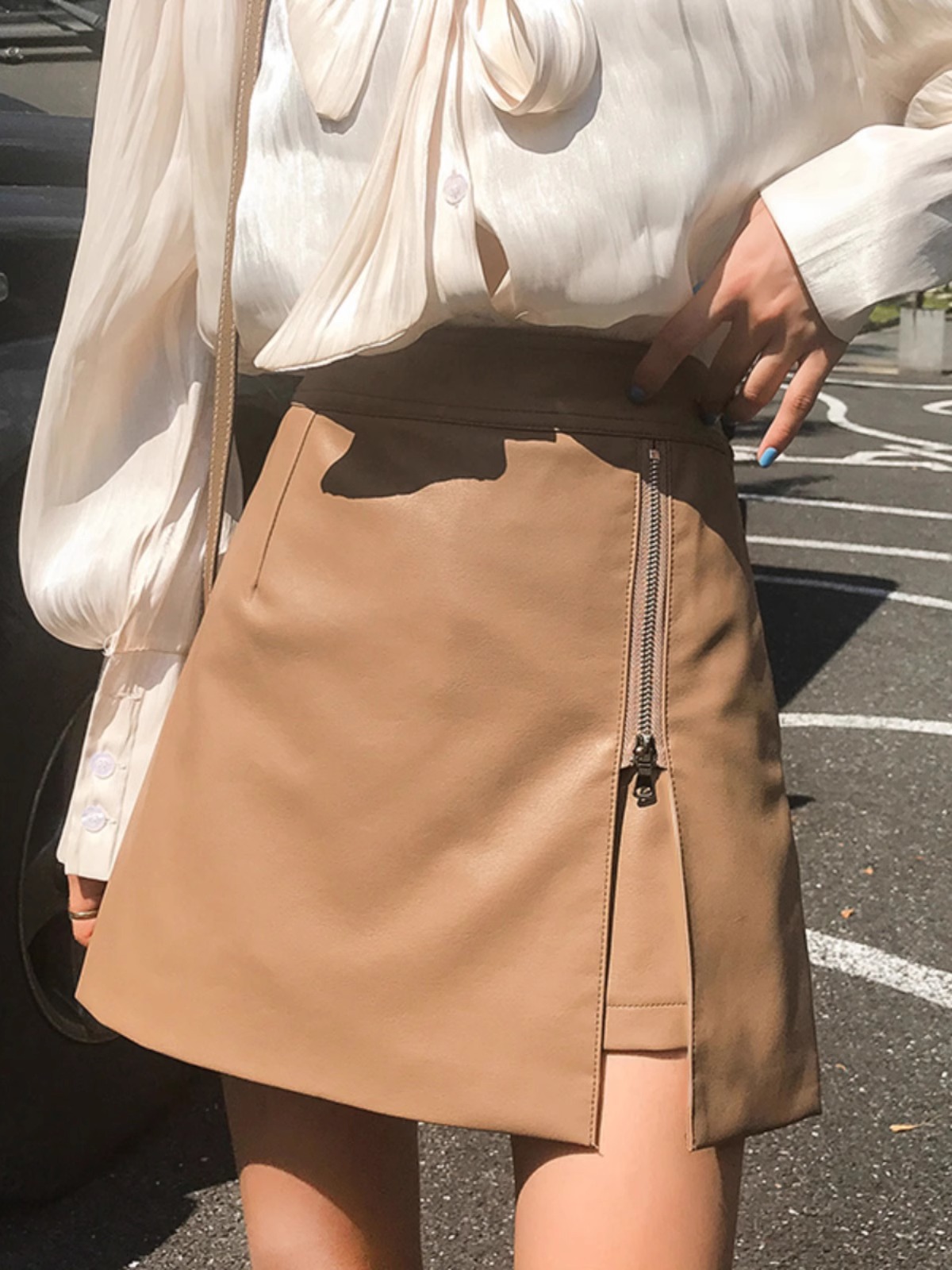 Picture of 2023 Autumn and Winter Elegant PU Leather Skirt Women's High Waist Slimming Irregular Hip Skirt Fashionable Korean A- line Skirt