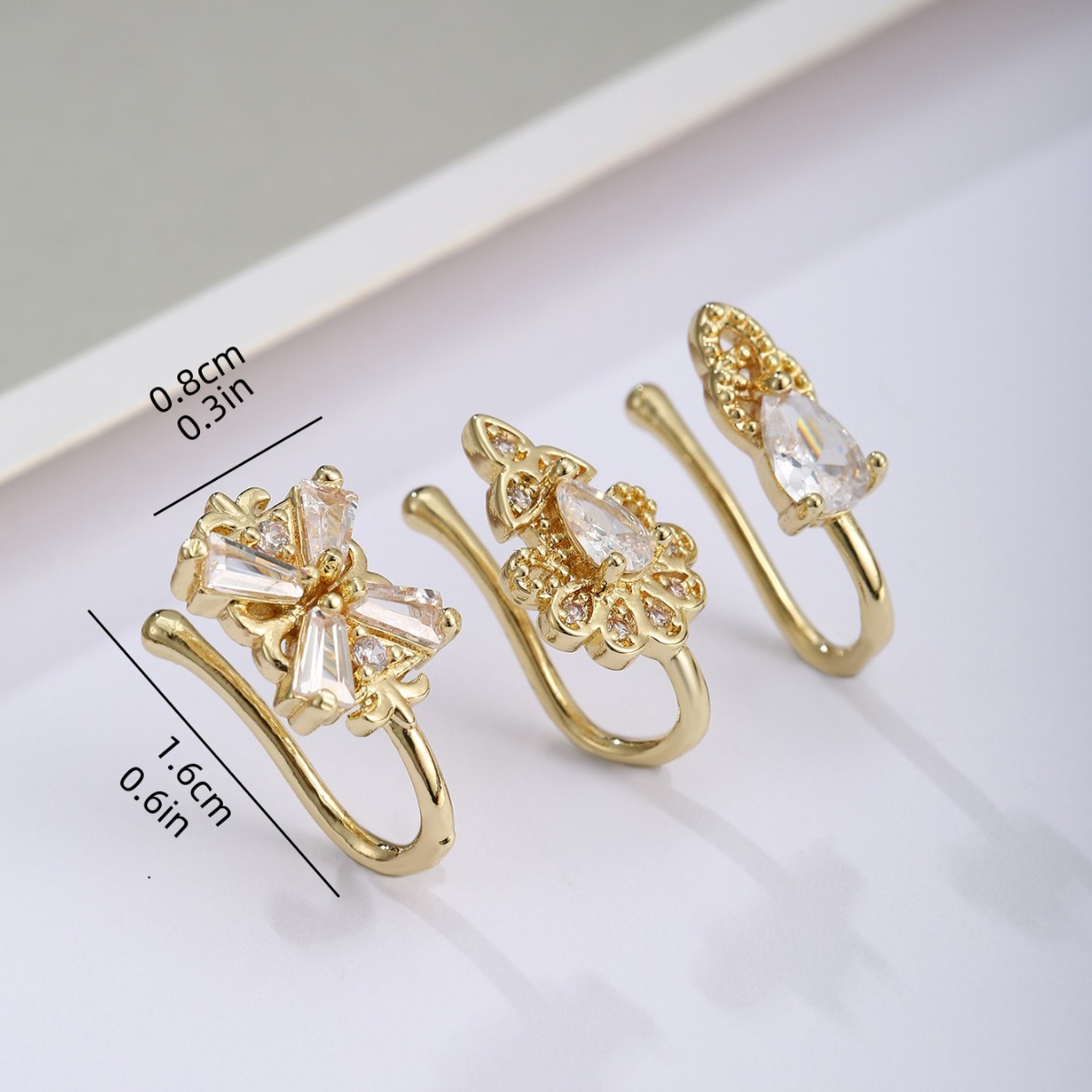 Picture of Exquisite and fashionable three-piece four-leaf clover copper plated real gold micro-inlaid zircon nose clip suit best-selling European and American nose combination