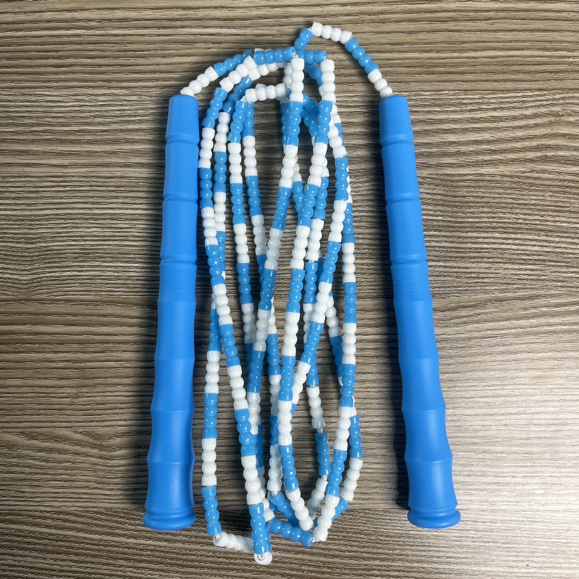 Picture of Manufacturer Wholesale Children's Fitness Sports Pattern Skipping Rope Kindergarten Competition Soft Bead Bamboo Skipping Rope for Primary School Students