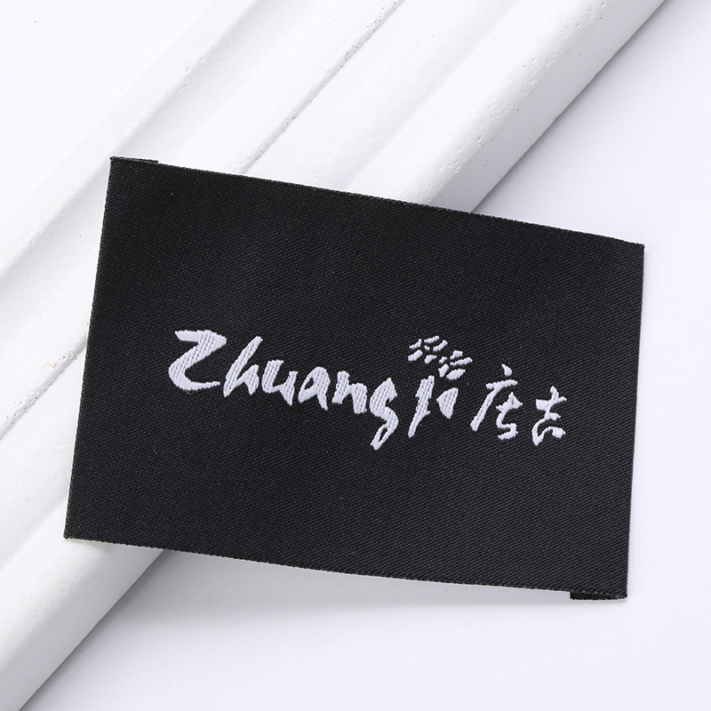 Picture of Manufacturers supply all kinds of woven marks, collar marks, clothing accessories, trademarks, logo woven marks, folded letters, sizes, washed marks