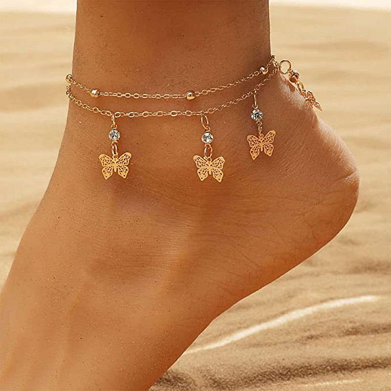 European and American fashion hot selling beach Diamond foot decoration wholesale fashion double ball chain hollow butterfly tassel anklet