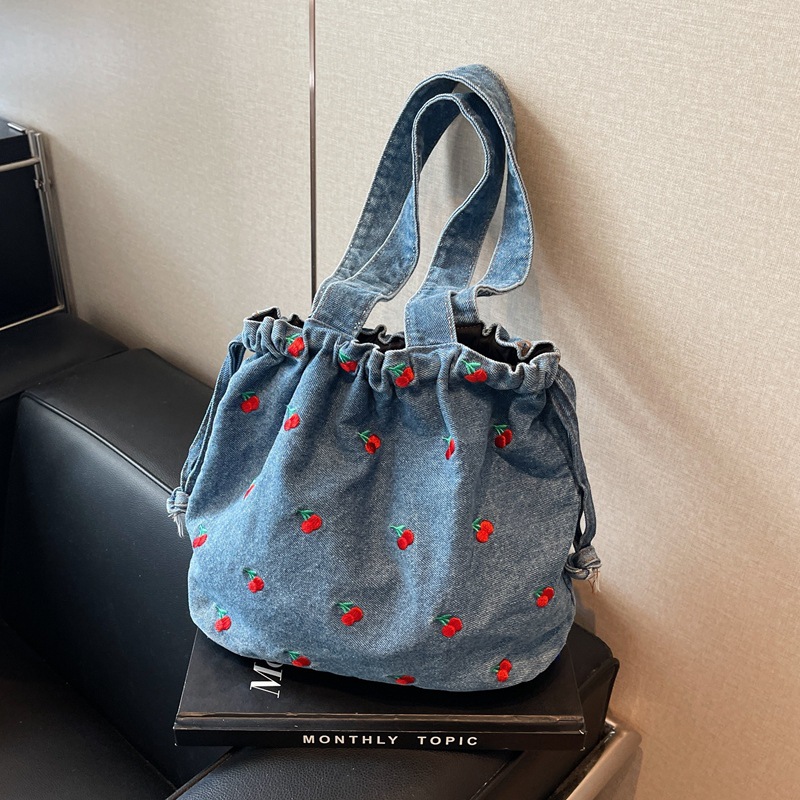 Picture of Foreign Order 2025 New Denim Bucket Bag Large Capacity Women's Bag Niche Design Shoulder Bag High-End Armpit Bag Trendy