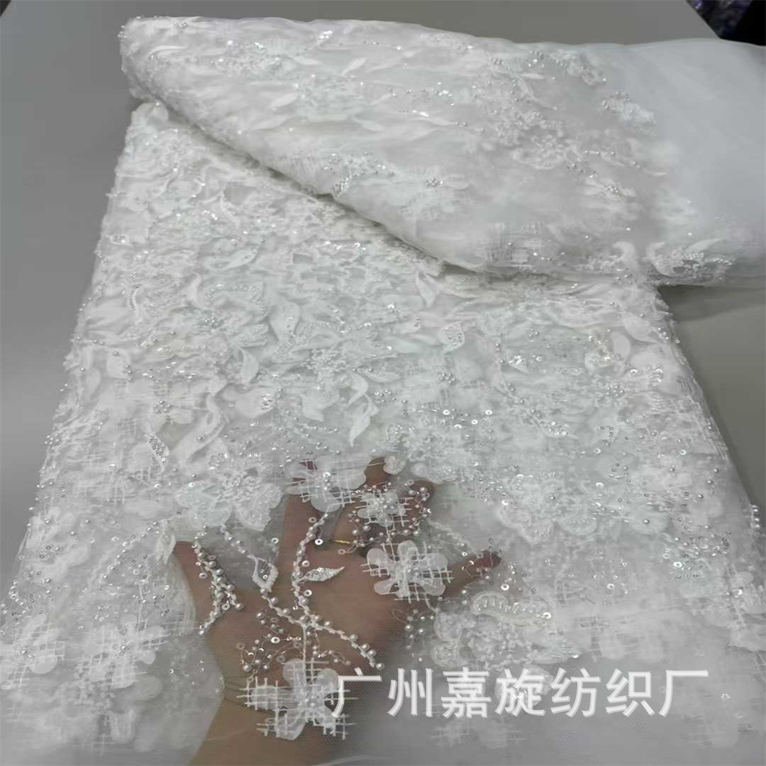 Picture of 2025 New Laser Floral Mesh Yarn Bead Tube Embroidery 3D Applique Pearl Sequin Embroidery Fashion Lace Fabric Beaded