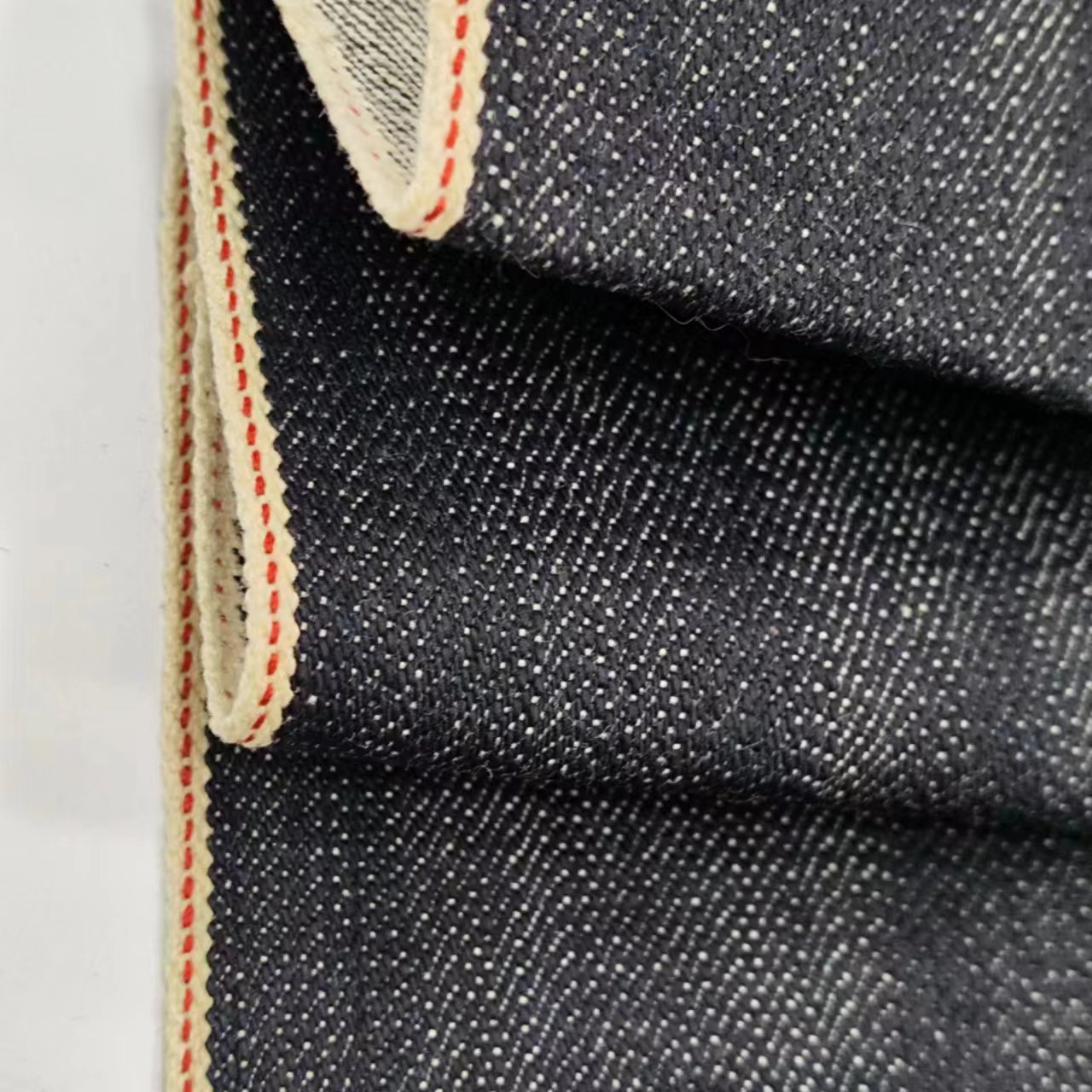 Special dark blue red edge red ear denim 17 oz non-elastic twill high-end Denim coat fabric trend