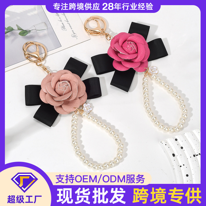 Picture of Camellia Keychain Bow Pearl Chain Versatile Mobile Phone Bag Pendant Female Creative Personalized Pendant Key Chain