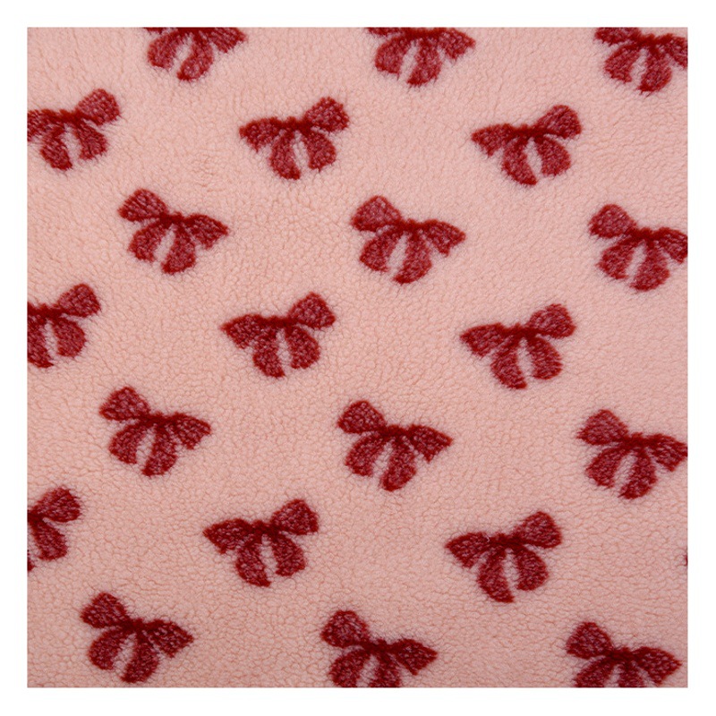 In stock 370g bowknot jacquard lambswool granular fleece jacquard lambswool fabric plush coat toy fleece