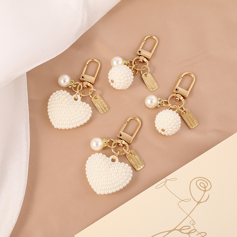 New Pearl Alloy Keychain Pendant Creative Pearl Hollow Love Accessories Bluetooth Headset Box Bag Hanging Ornaments